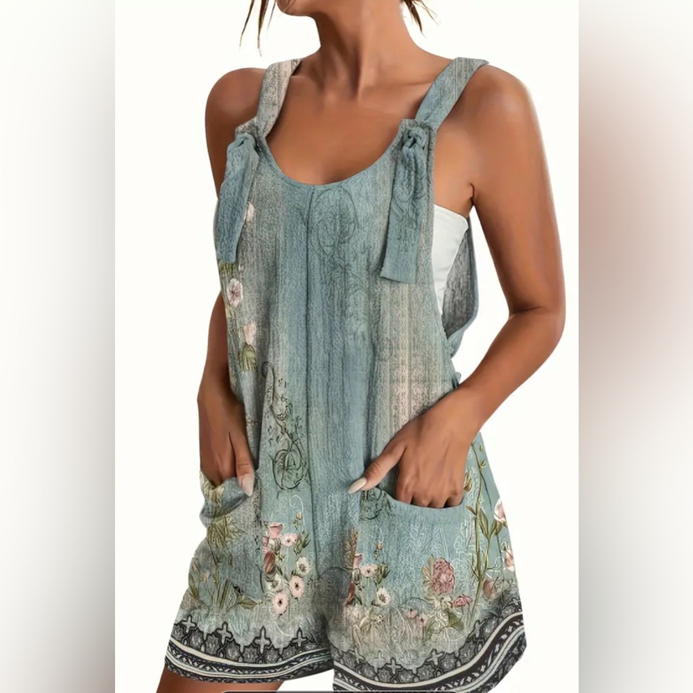 Pastel blue multi romper. Size: Medium. Romper Shorts. Never worn-brand new!